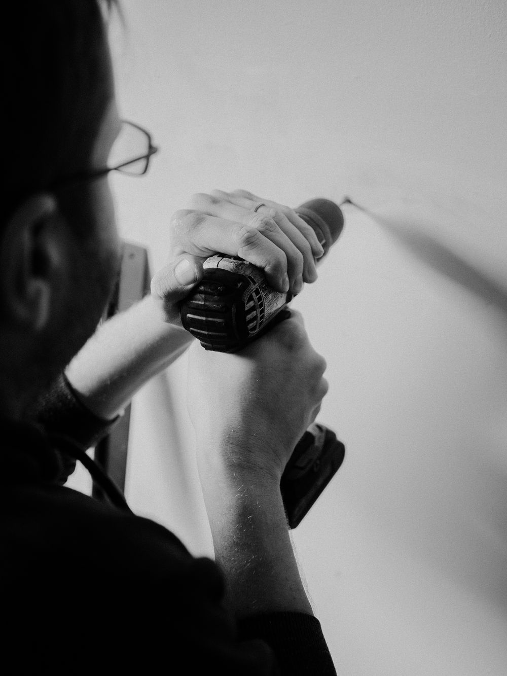 Drilling into a wall to install an anchor